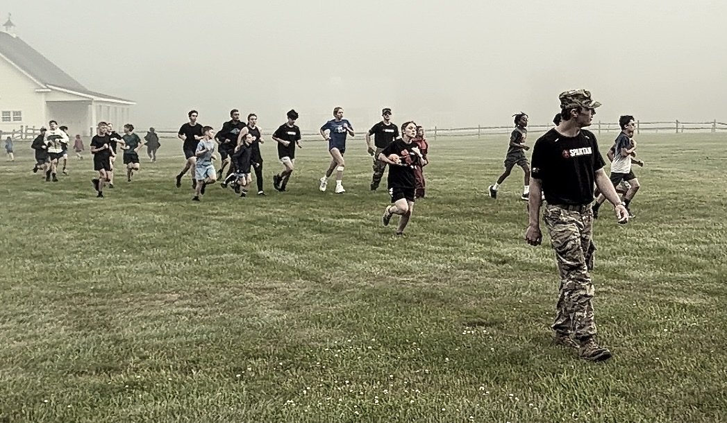 Runners moving through fog on Joe's Mountain in Pittsfield